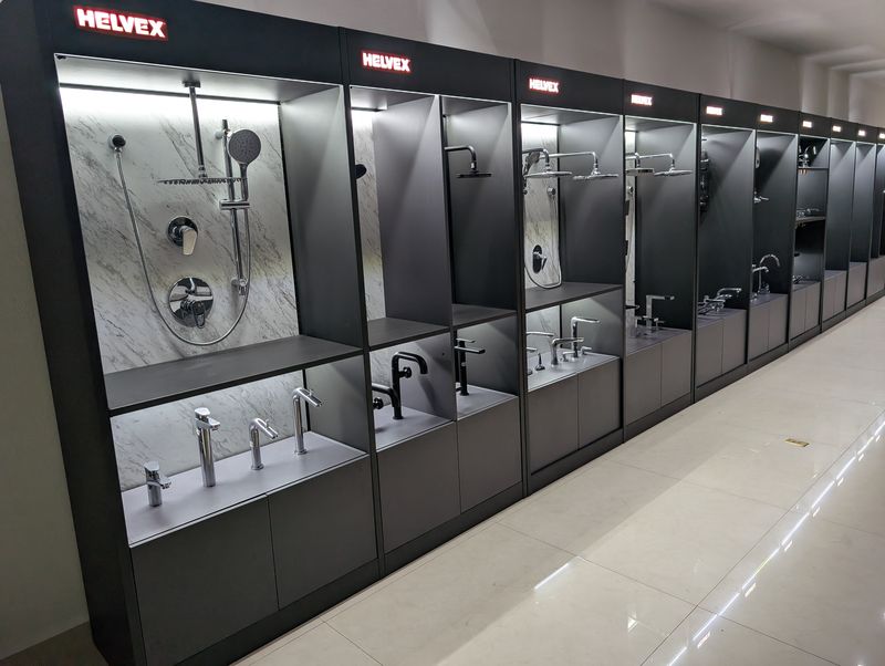 Row of wall modules for showers and faucets