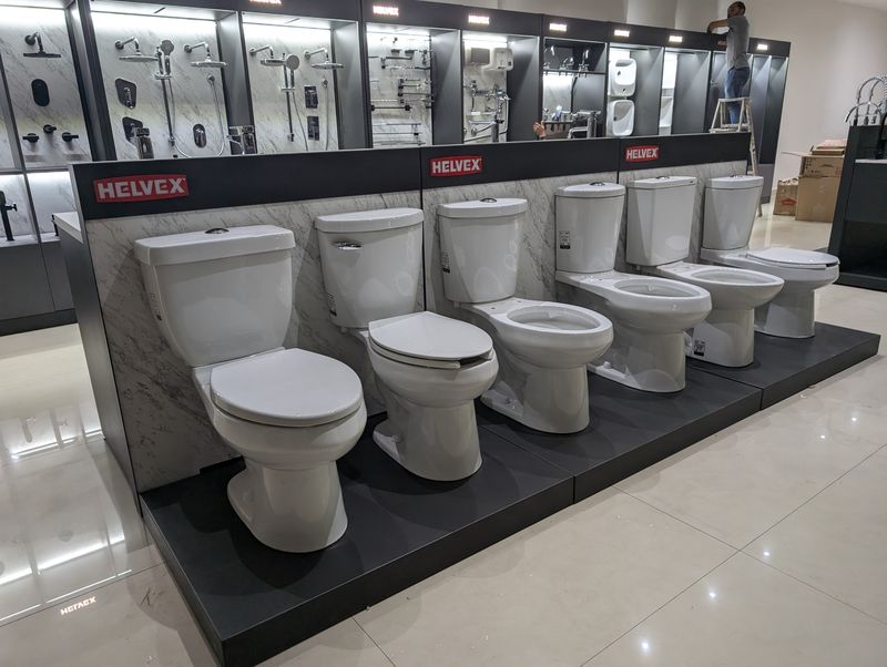 Toilet display platform with branded header