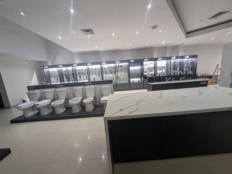 Showroom floor overview: faucet island, toilet platform and product walls
